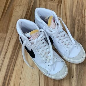 Women’s size 7 white Nike high tops.